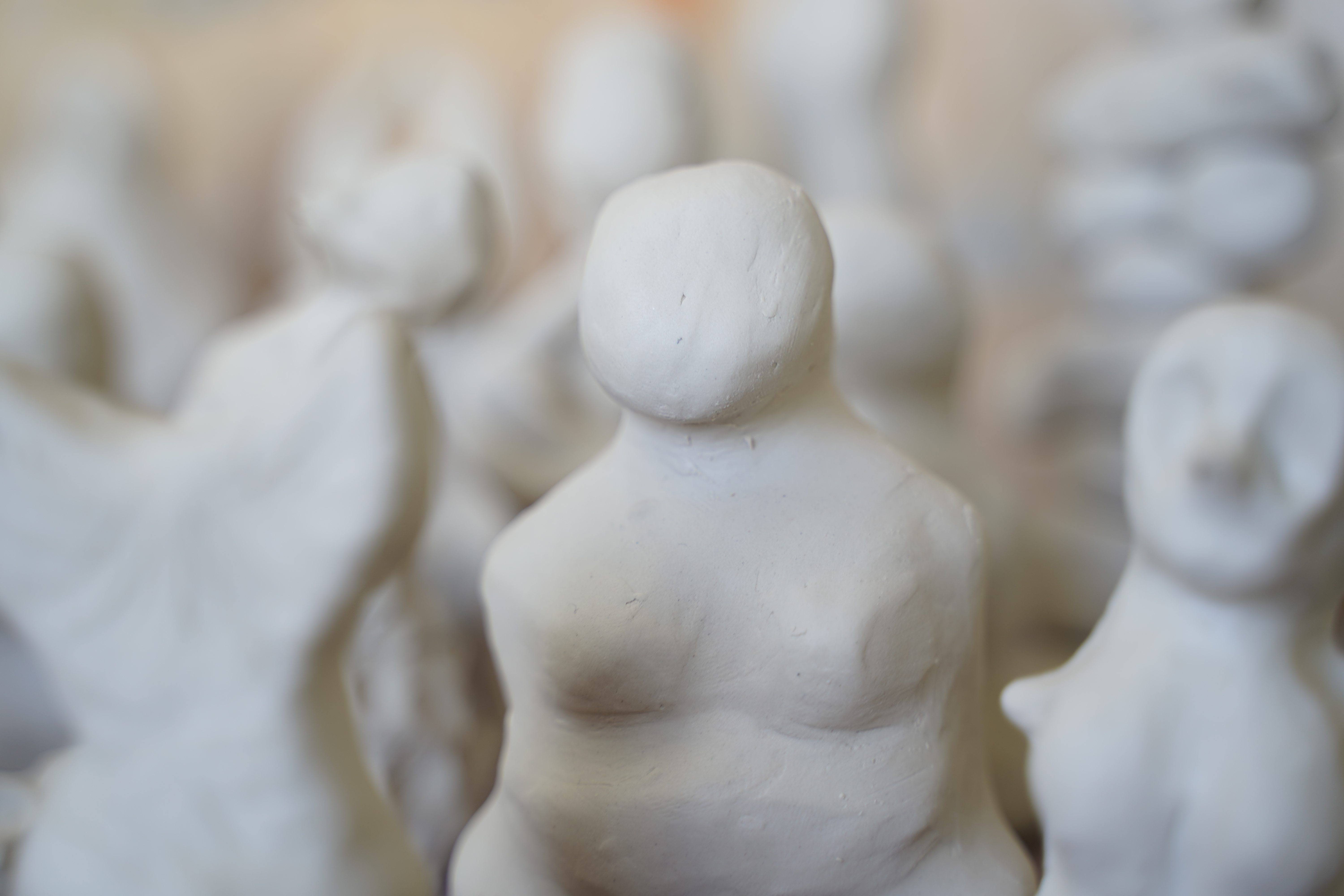 Female clay figurines created for IWD Shaping Femininity progressive art workshop