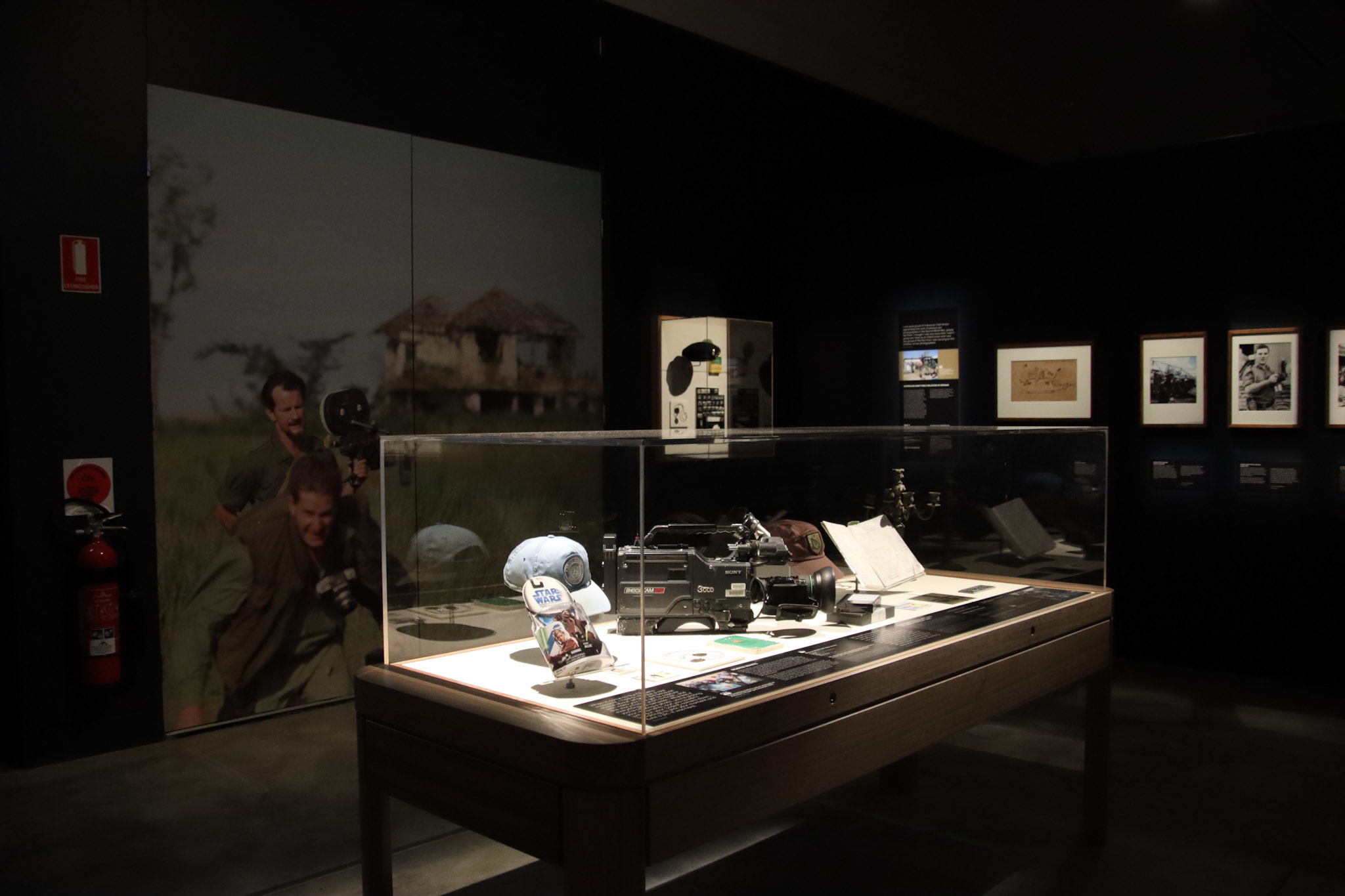 A camera and objects display featured in Action! Film and War