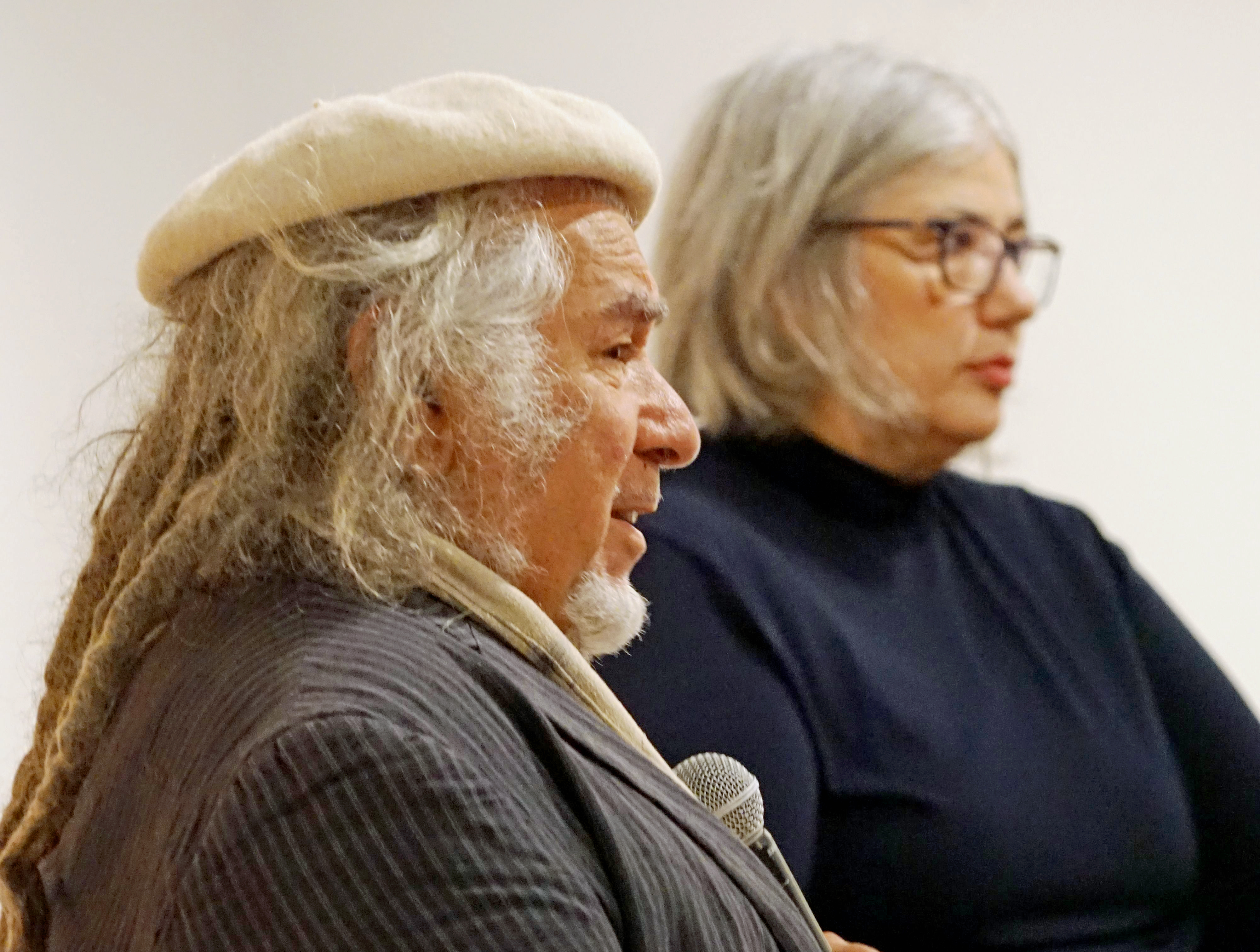 Djon Mundine, In Conversation with Marina Strocchi for Three Echoes: Western Desert Art at Caboolture Regional art Gallery 2022. Image courtesy Museums & Galleries QLD, Photograph by Andrea Higgins.